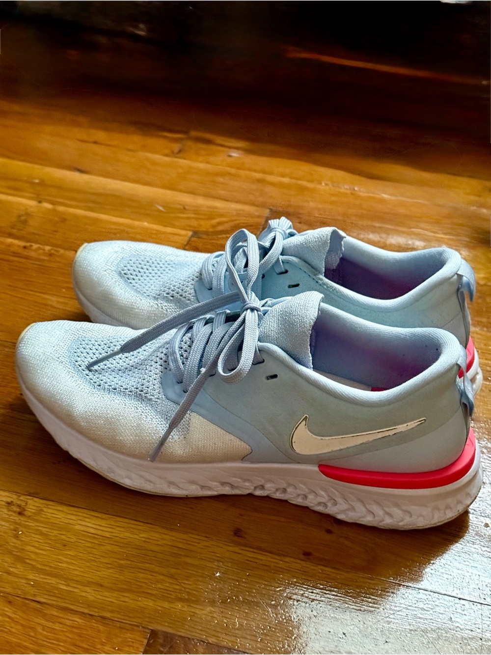Nike Women's Light Blue Running Shoes with Pink Accent
